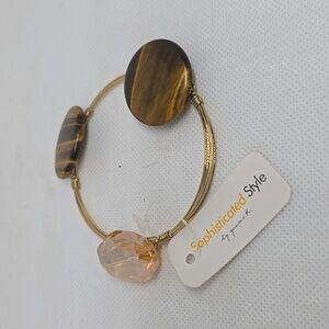 Gold wire bracelet with gold/black stones